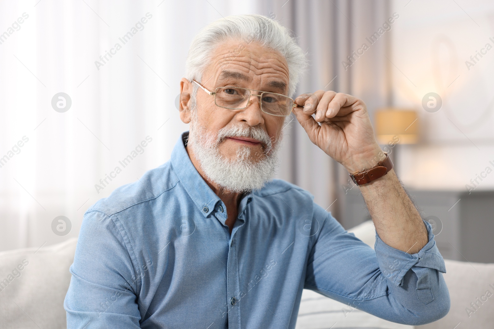 Photo of Portrait of handsome bearded man at home