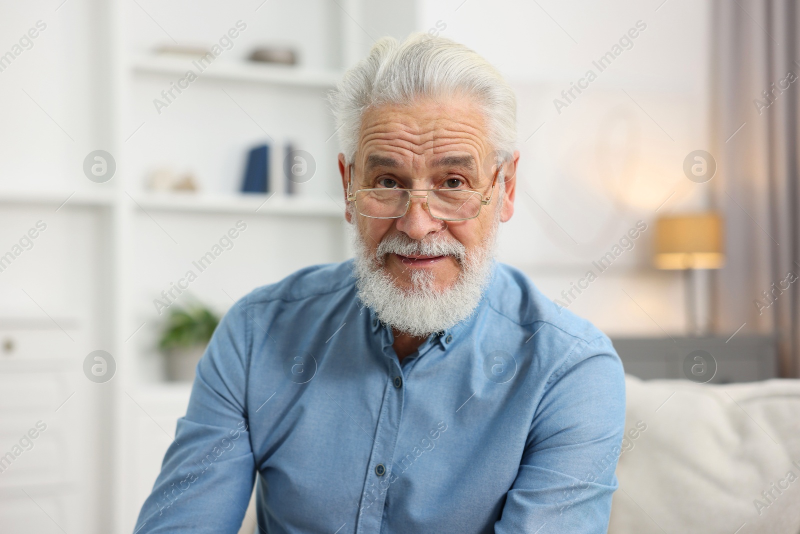 Photo of Portrait of handsome bearded man at home