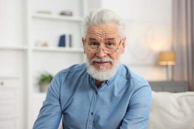 Photo of Portrait of handsome bearded man at home