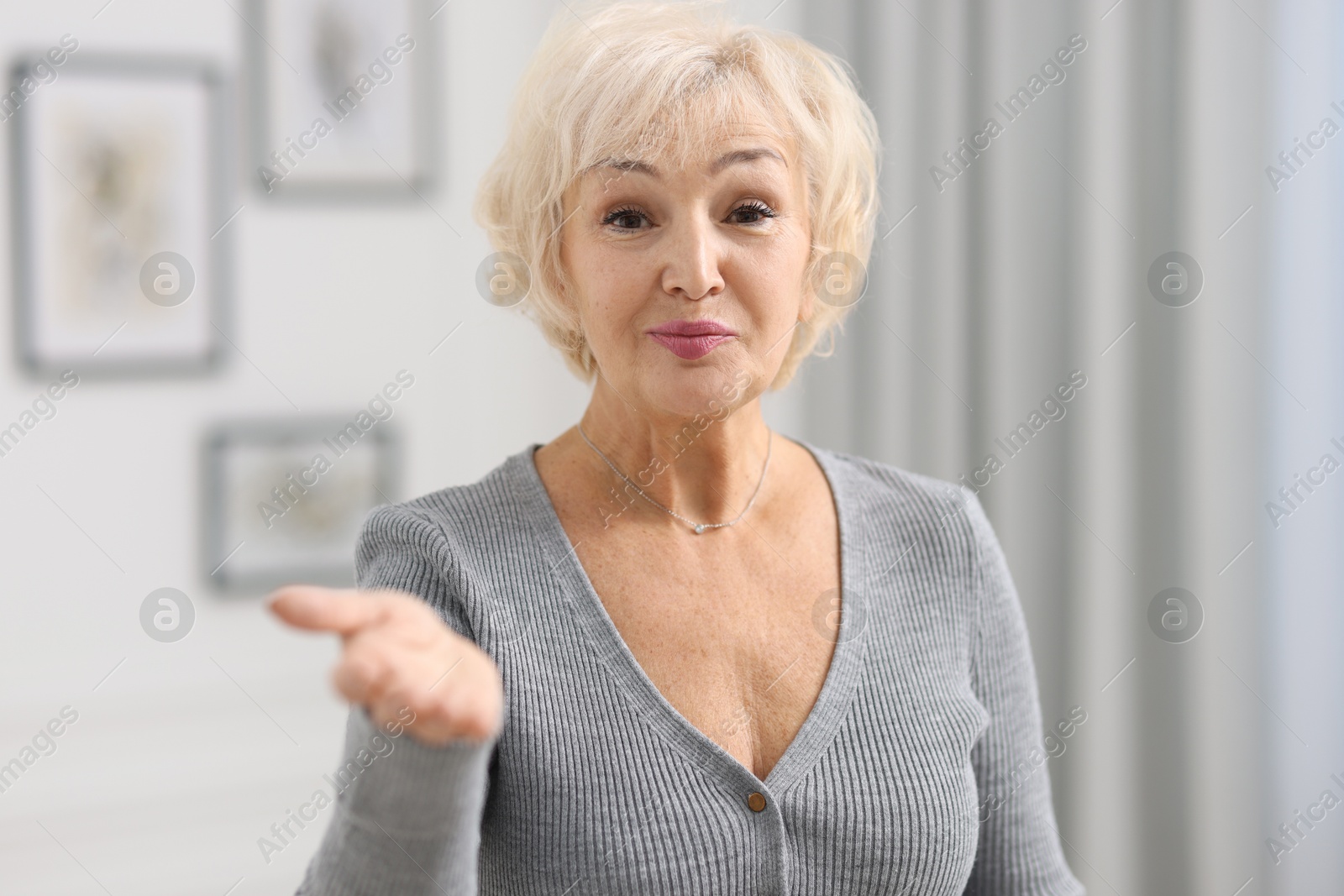 Photo of Portrait of grandmother with beautiful makeup at home