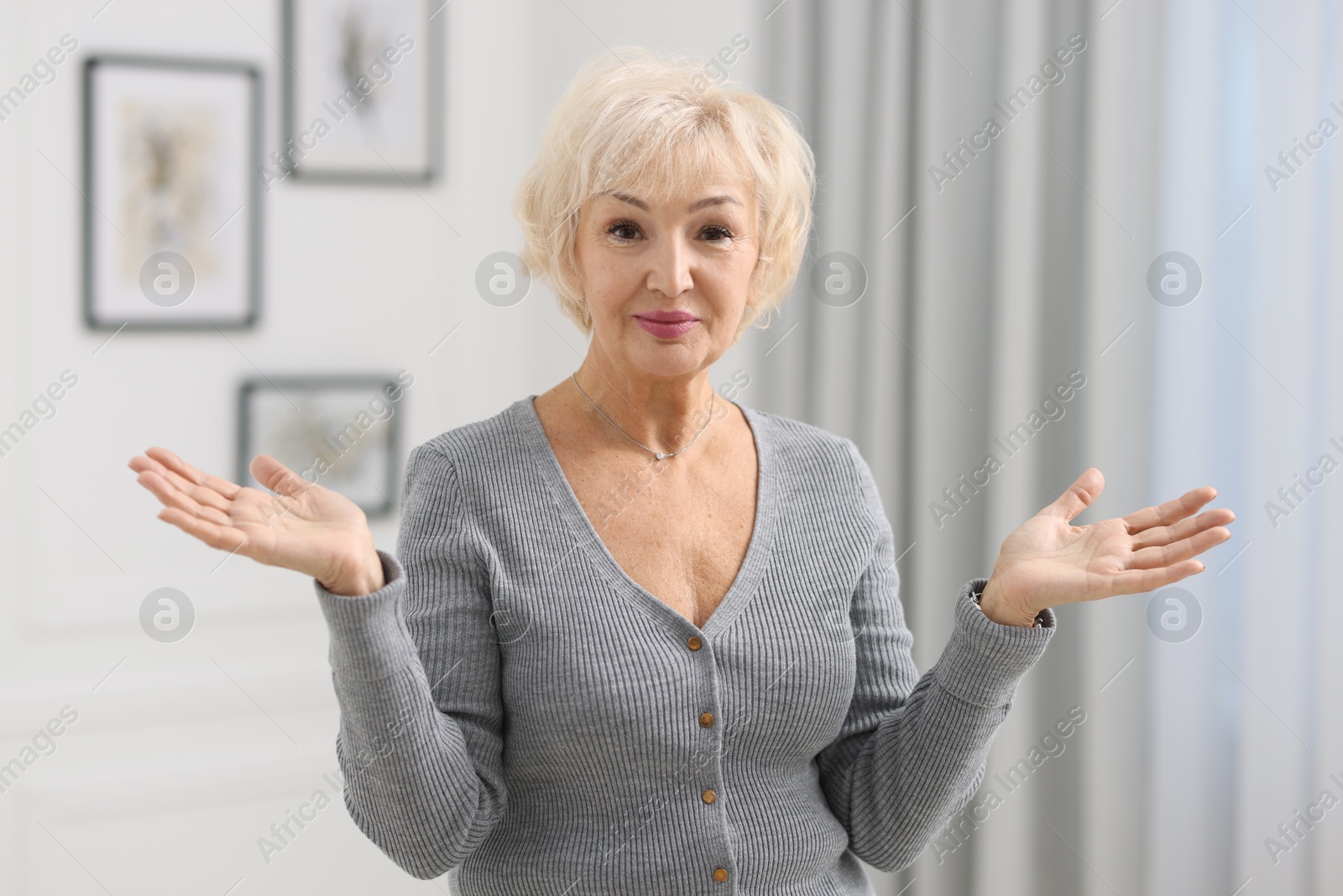 Photo of Portrait of grandmother with beautiful makeup at home