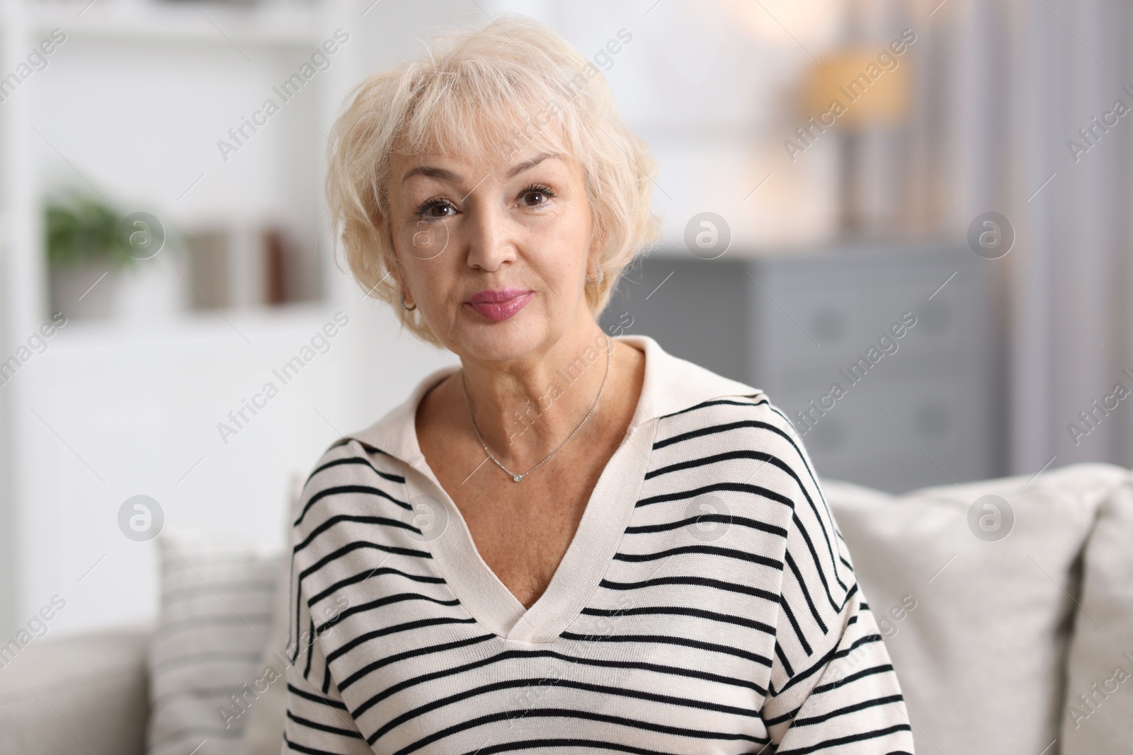 Photo of Portrait of grandmother with beautiful makeup at home