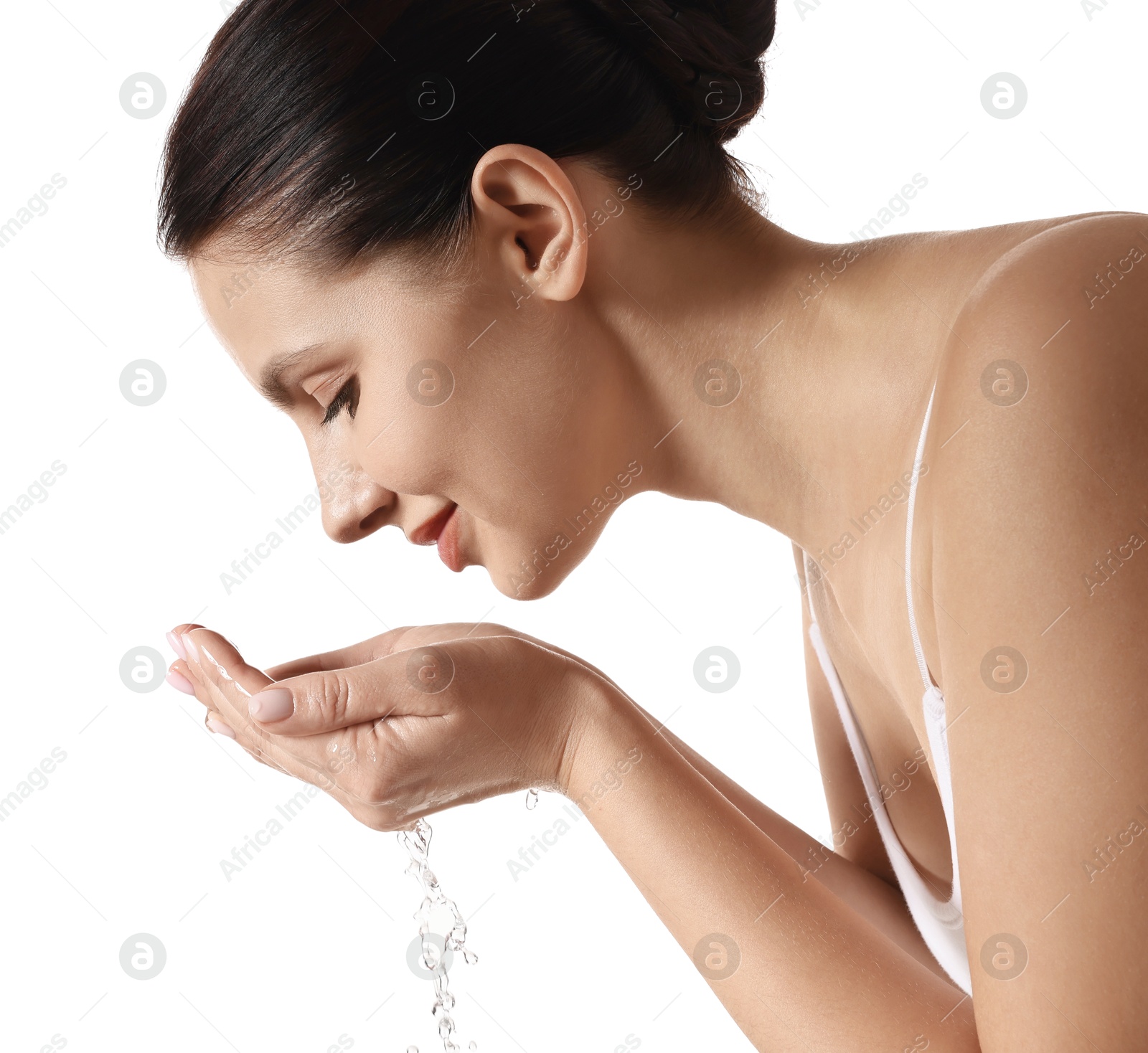 Photo of Attractive woman washing her face on white background