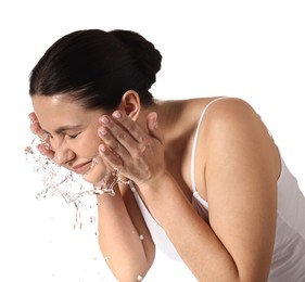 Photo of Attractive woman washing her face on white background