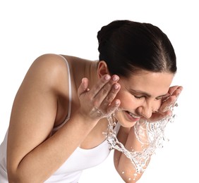 Photo of Smiling woman washing her face on white background