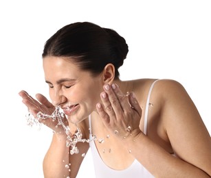 Photo of Smiling woman washing her face on white background