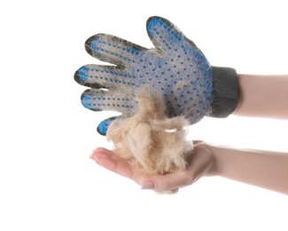 Photo of Woman in grooming glove holding pile of pet's hair on white background, closeup