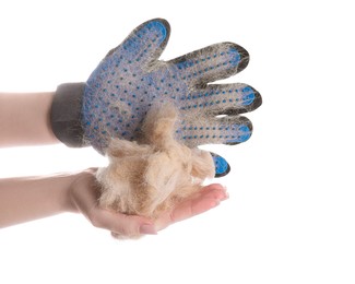 Photo of Woman in grooming glove holding pile of pet's hair on white background, closeup