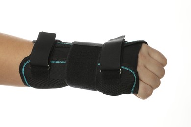 Photo of Injured woman with wrist brace on white background, closeup