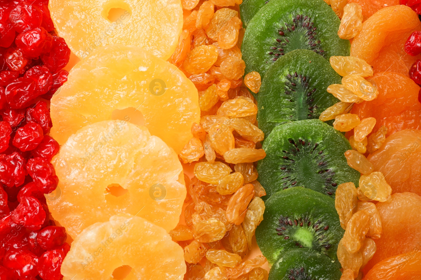 Photo of Different dried fruits as background, top view