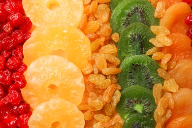 Photo of Different dried fruits as background, top view