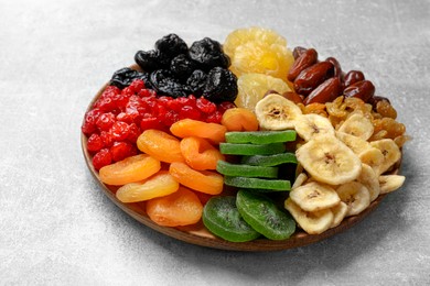 Photo of Different dried fruits on grey table, closeup