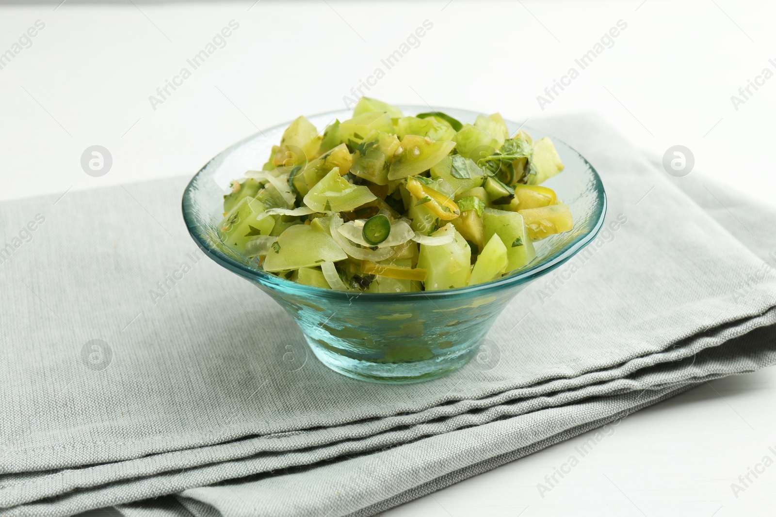 Photo of Delicious salsa (Pico de gallo) in bowl on white table, closeup