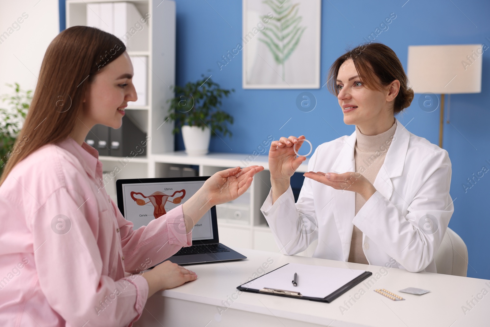 Photo of Contraception. Gynecologist recommending vaginal ring to woman in clinic