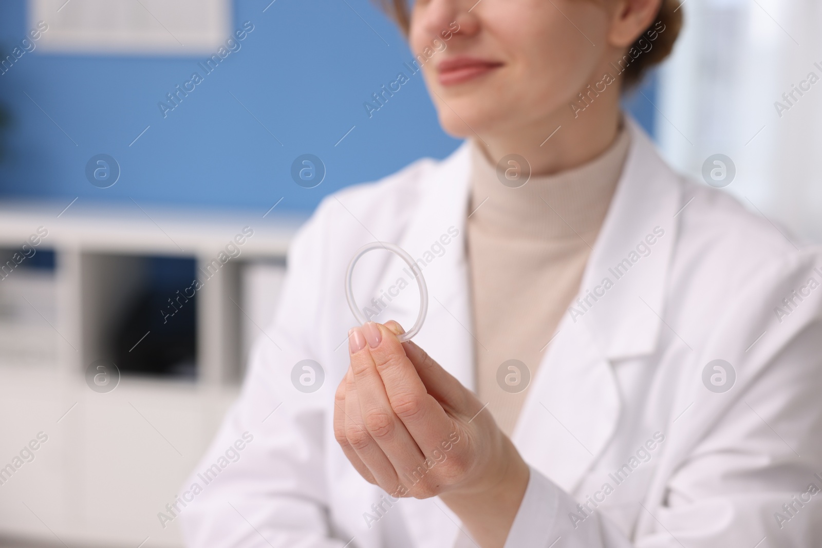 Photo of Contraception. Gynecologist showing vaginal ring in clinic, closeup