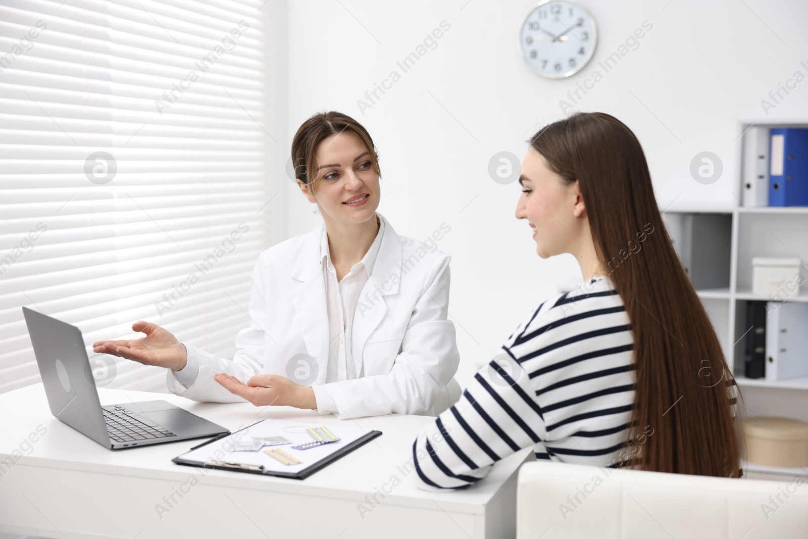 Photo of Contraception. Woman having appointment with gynecologist in clinic