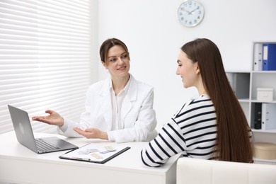 Contraception. Woman having appointment with gynecologist in clinic