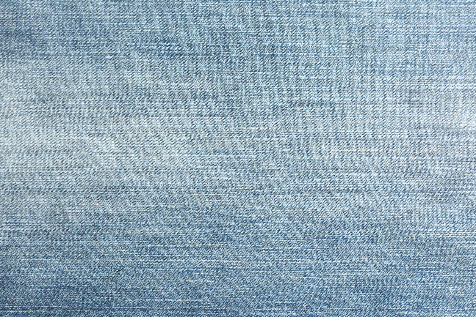 Photo of Texture of blue jeans as background, closeup