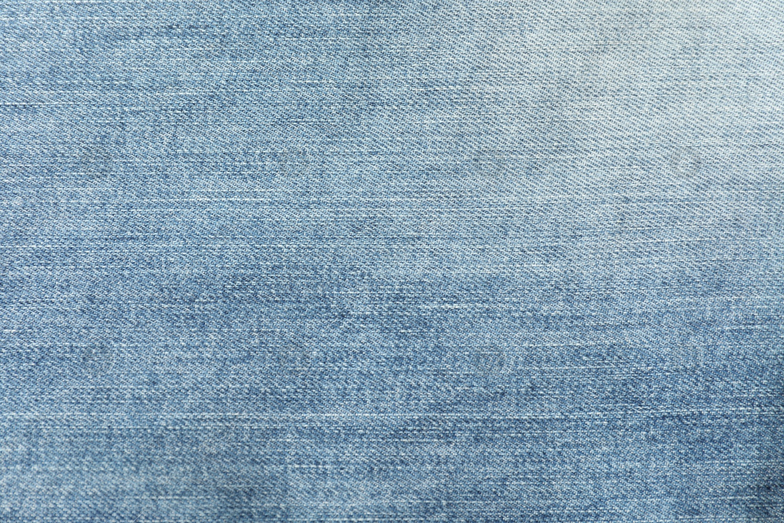 Photo of Texture of blue jeans as background, closeup