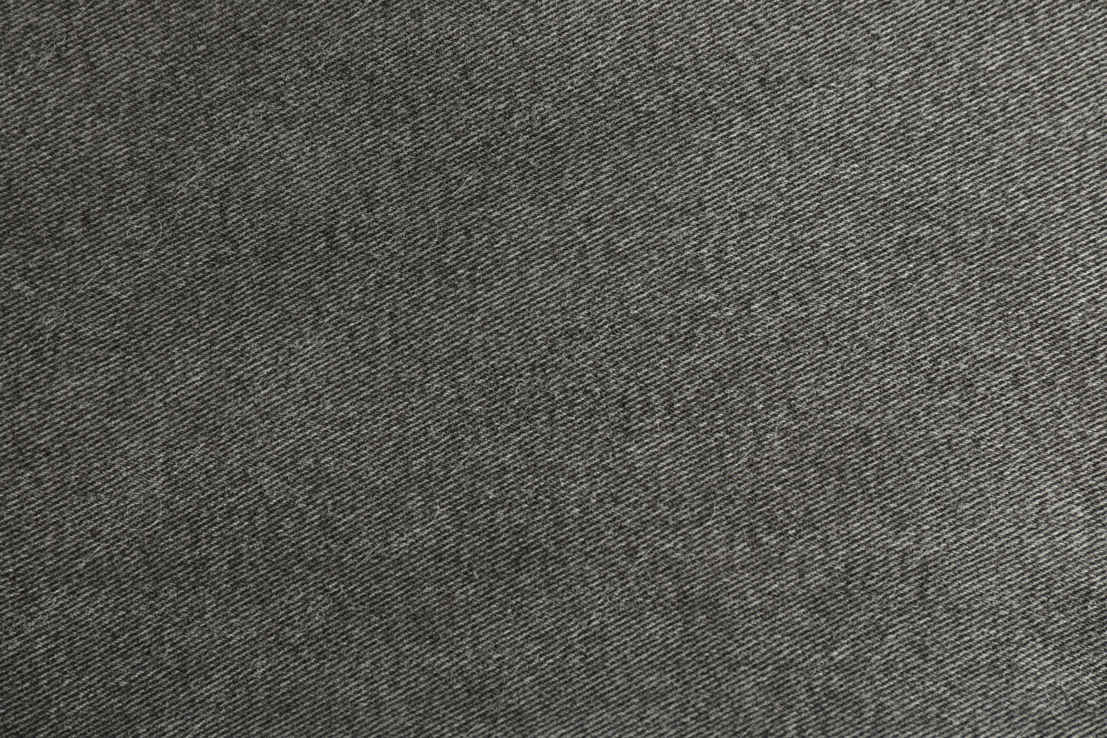 Photo of Texture of black jeans as background, closeup