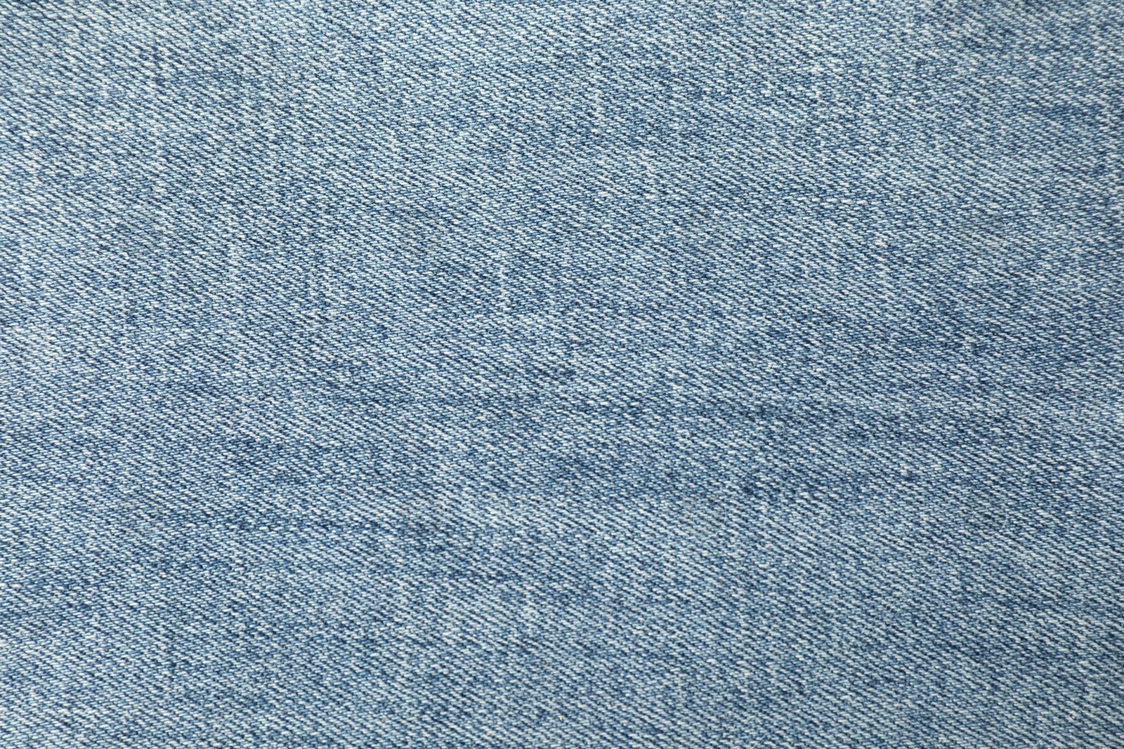 Photo of Texture of blue jeans as background, closeup