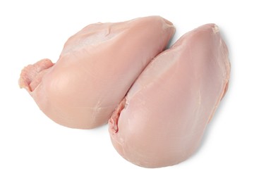 Photo of Two raw turkey breasts isolated on white, top view