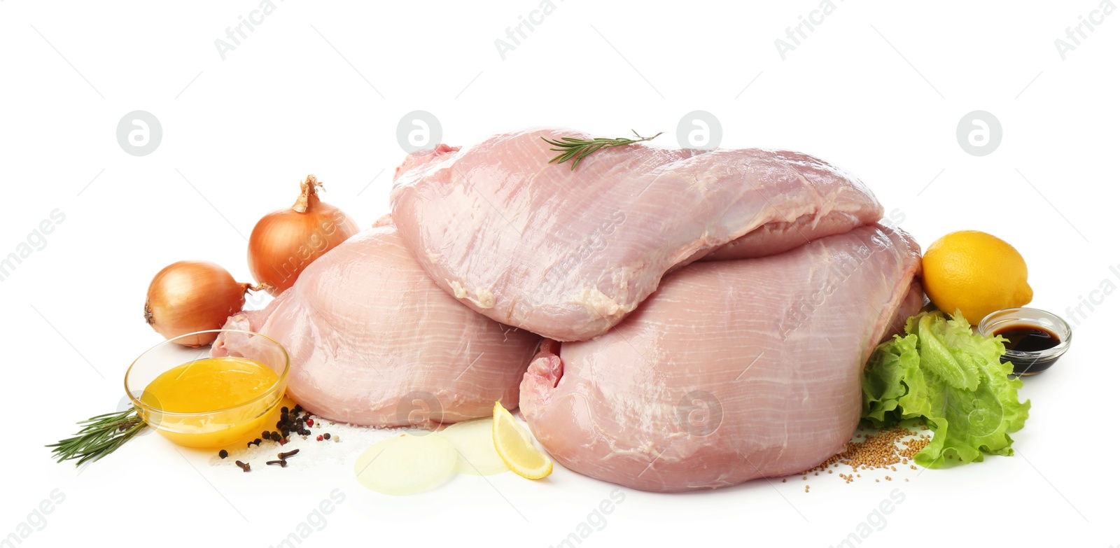 Photo of Raw turkey breasts and spices isolated on white