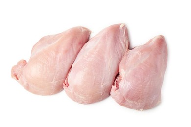 Photo of Three raw turkey breasts isolated on white, top view