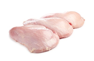 Photo of Three raw turkey breasts isolated on white