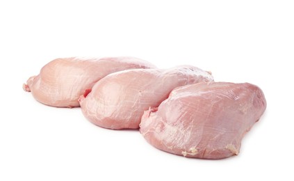 Photo of Three raw turkey breasts isolated on white