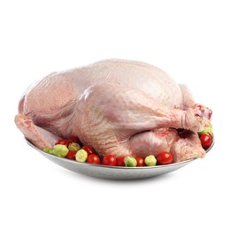 Photo of Whole raw turkey with vegetables isolated on white