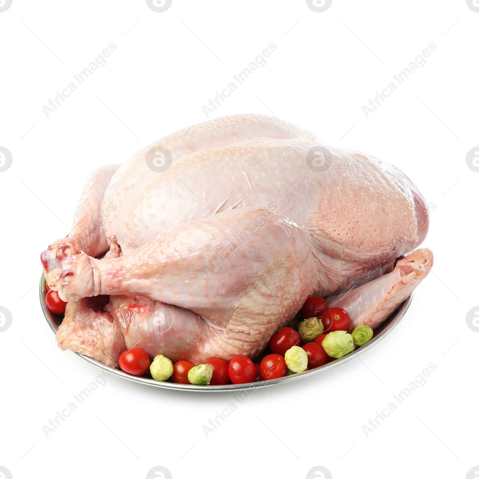 Photo of Whole raw turkey with vegetables isolated on white