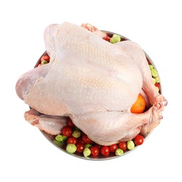 Photo of Whole raw turkey with vegetables isolated on white, top view