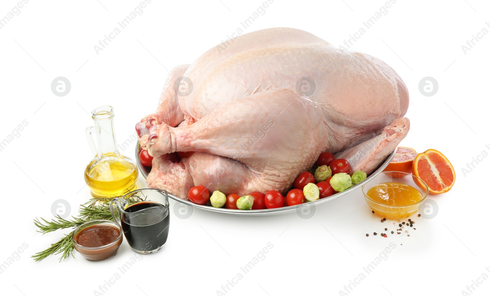 Photo of Whole raw turkey with ingredients isolated on white