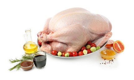 Photo of Whole raw turkey with ingredients isolated on white