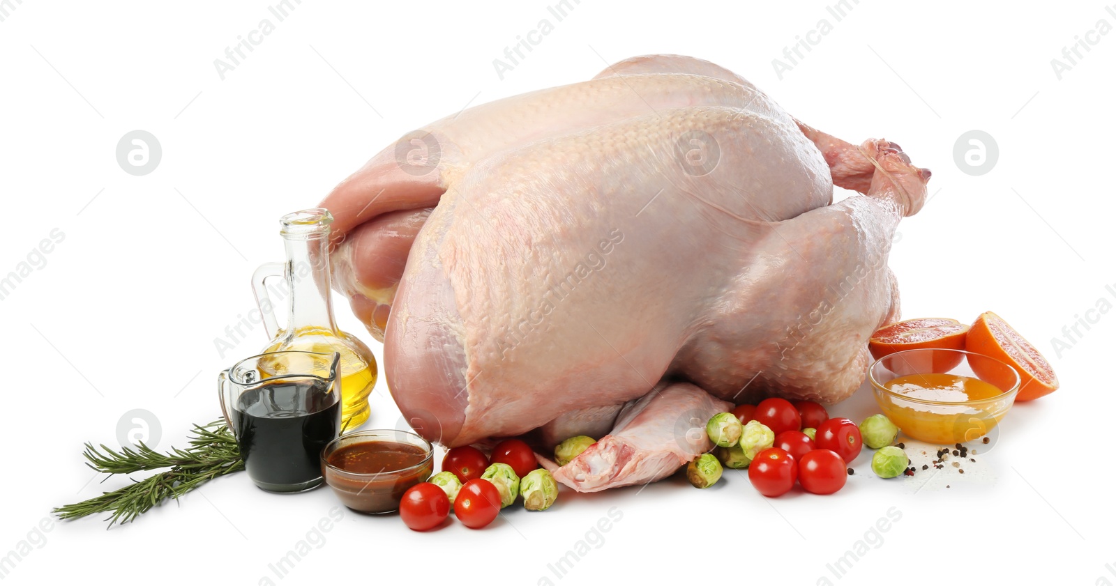 Photo of Whole raw turkey with ingredients isolated on white