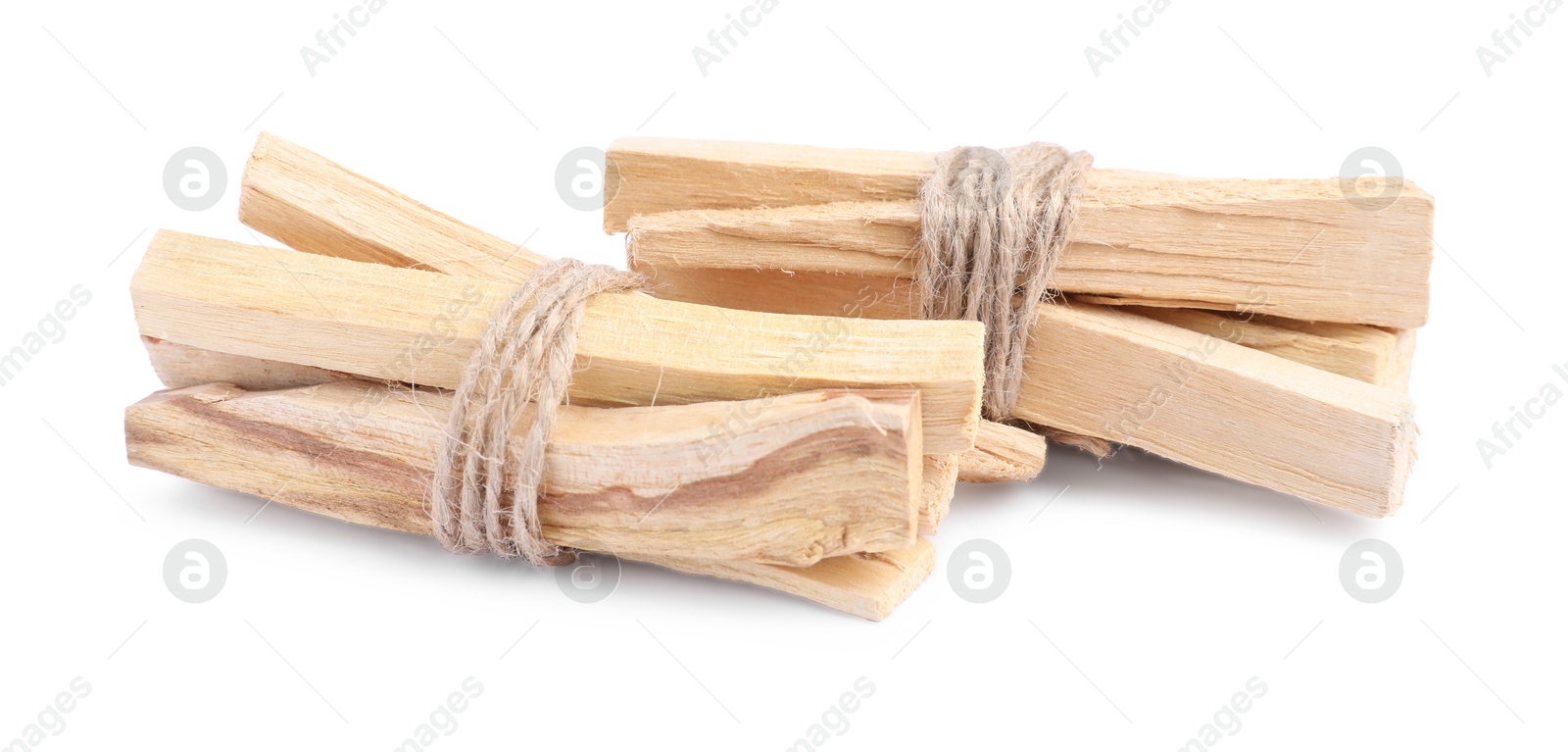 Photo of Bunches of palo santo sticks on white background