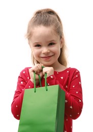 Cute little girl with shopping bag on white background