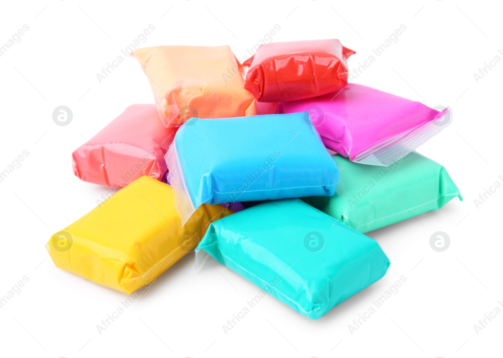 Photo of Different colorful play dough in packages isolated on white