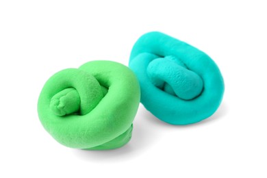 Photo of Turquoise and green play dough isolated on white