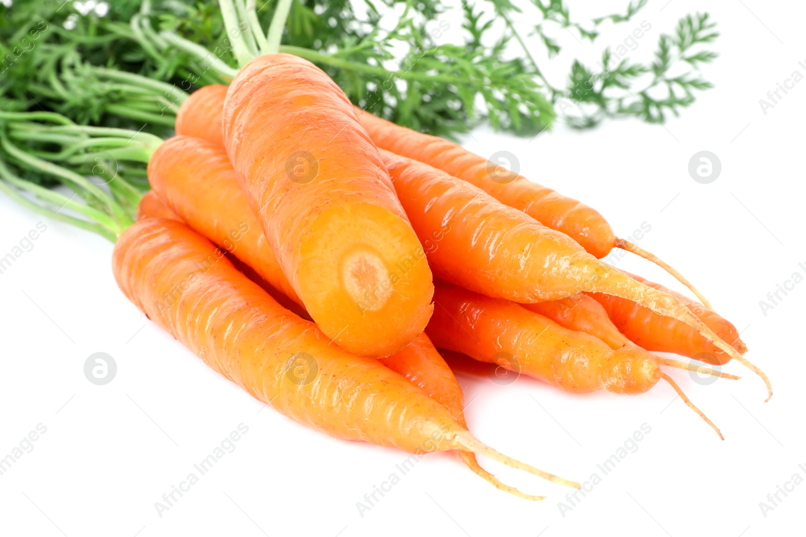 Photo of Fresh carrots isolated on white. Root vegetable