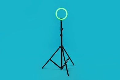 Photo of Ring lamp on stand against light blue background