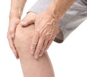 Senior man suffering from knee pain on white background, closeup