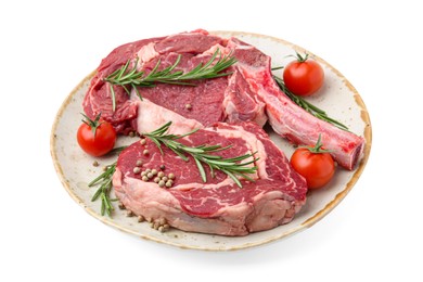 Photo of Pieces of raw beef meat, spices and tomatoes isolated on white