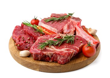 Photo of Pieces of raw beef meat, spices and tomatoes isolated on white