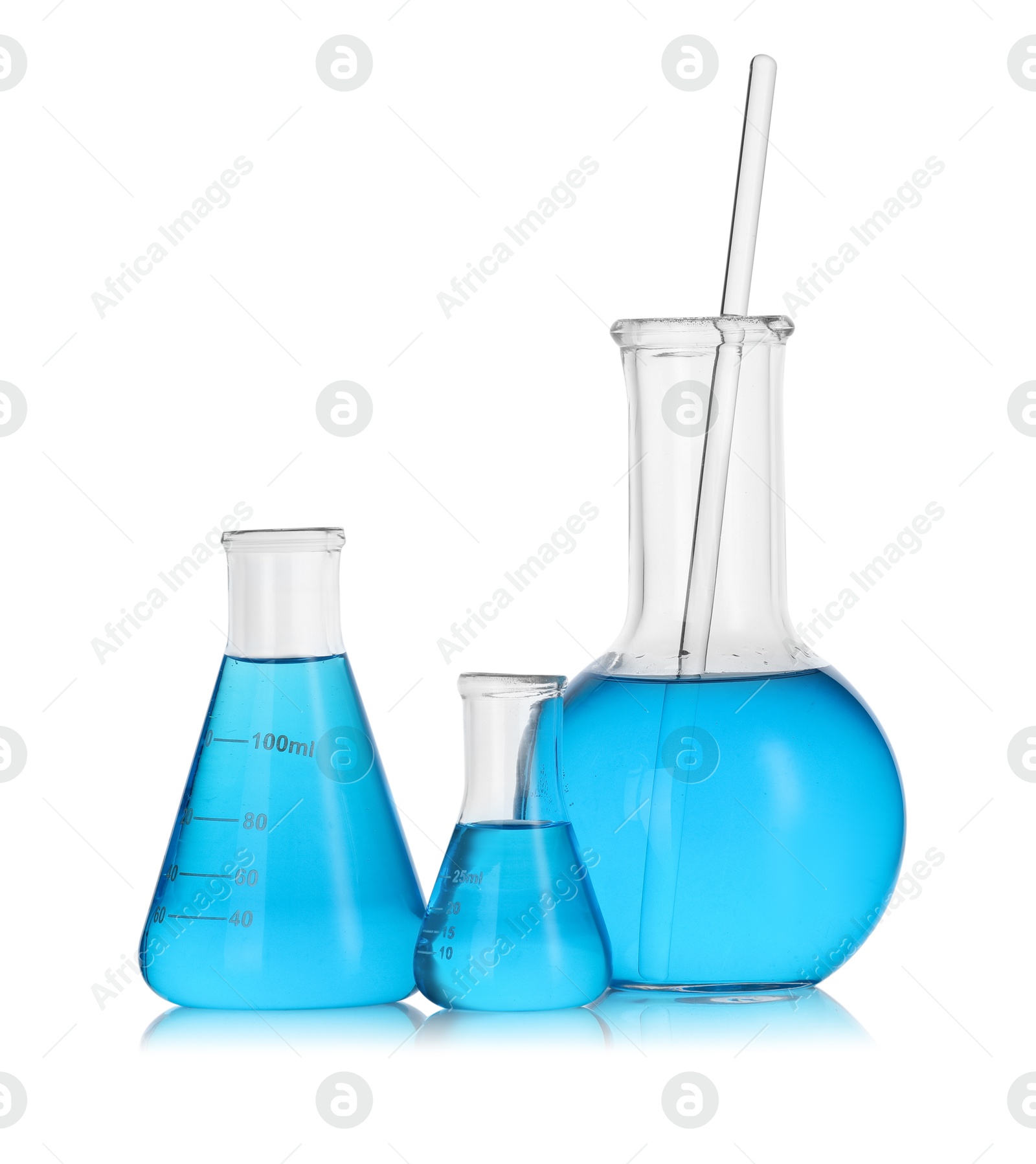 Photo of Laboratory glassware with blue liquid isolated on white