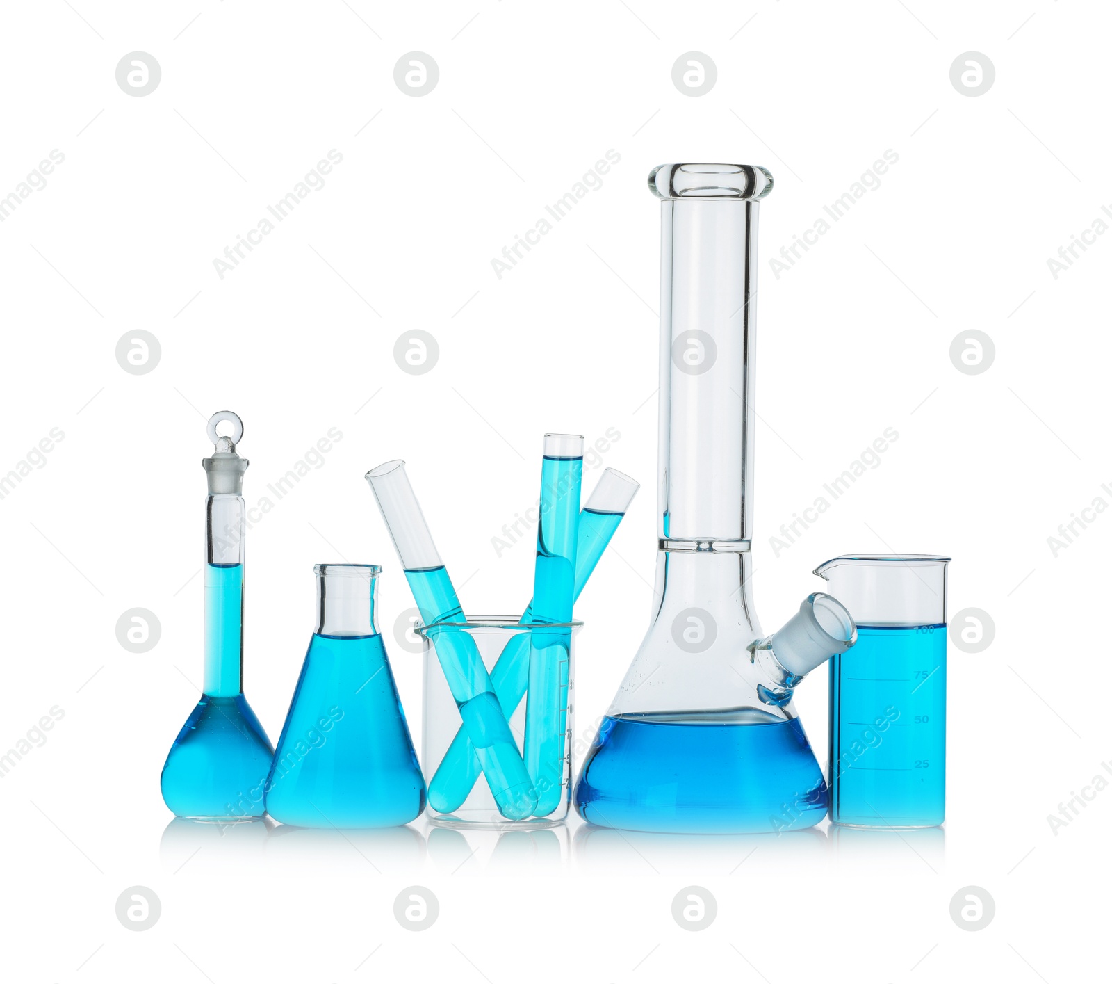 Photo of Laboratory glassware with blue liquid isolated on white