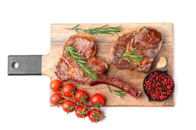 Photo of Pieces of delicious beef meat, spices and tomatoes isolated on white, top view