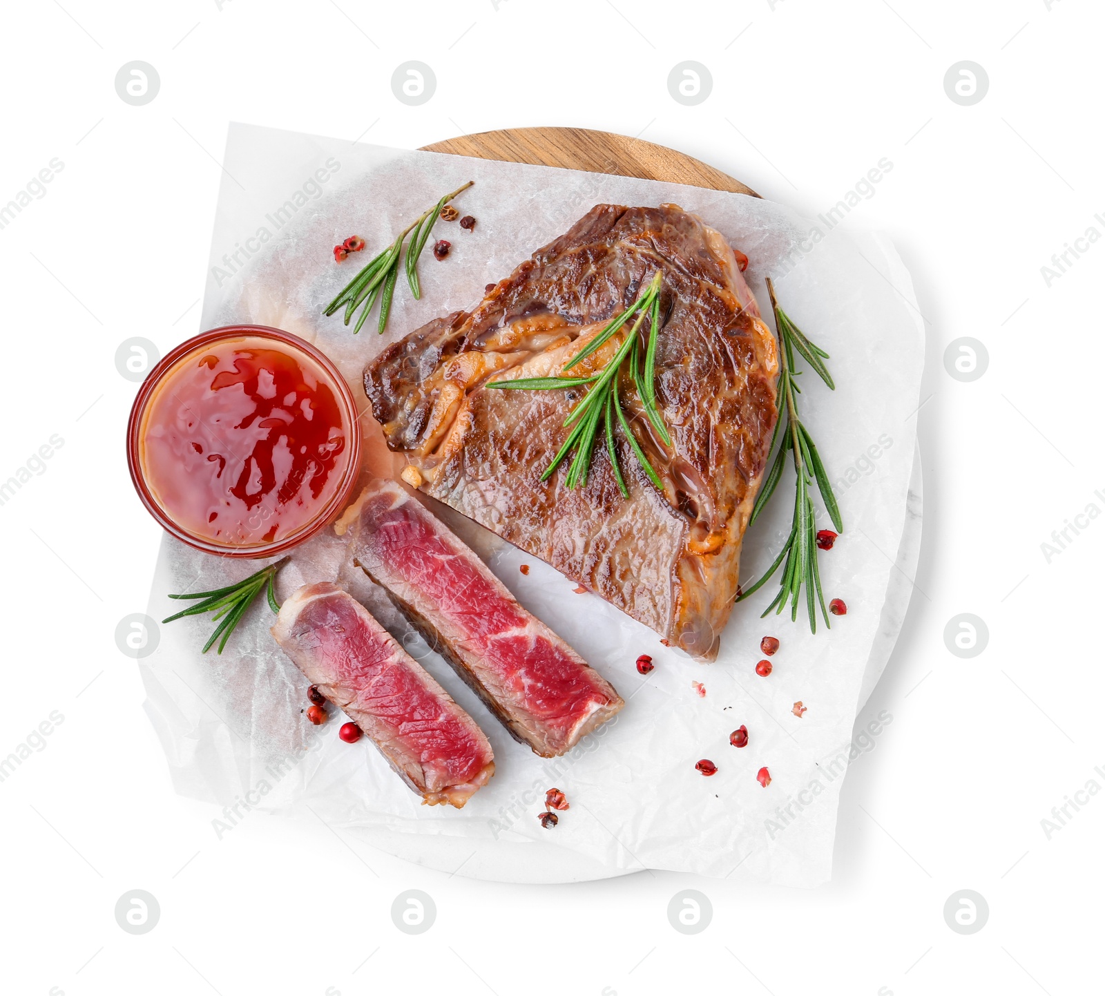 Photo of Pieces of delicious beef meat, spices and sauce isolated on white, top view