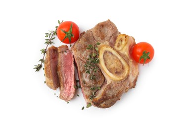 Photo of Pieces of delicious beef meat, thyme and tomatoes isolated on white, top view